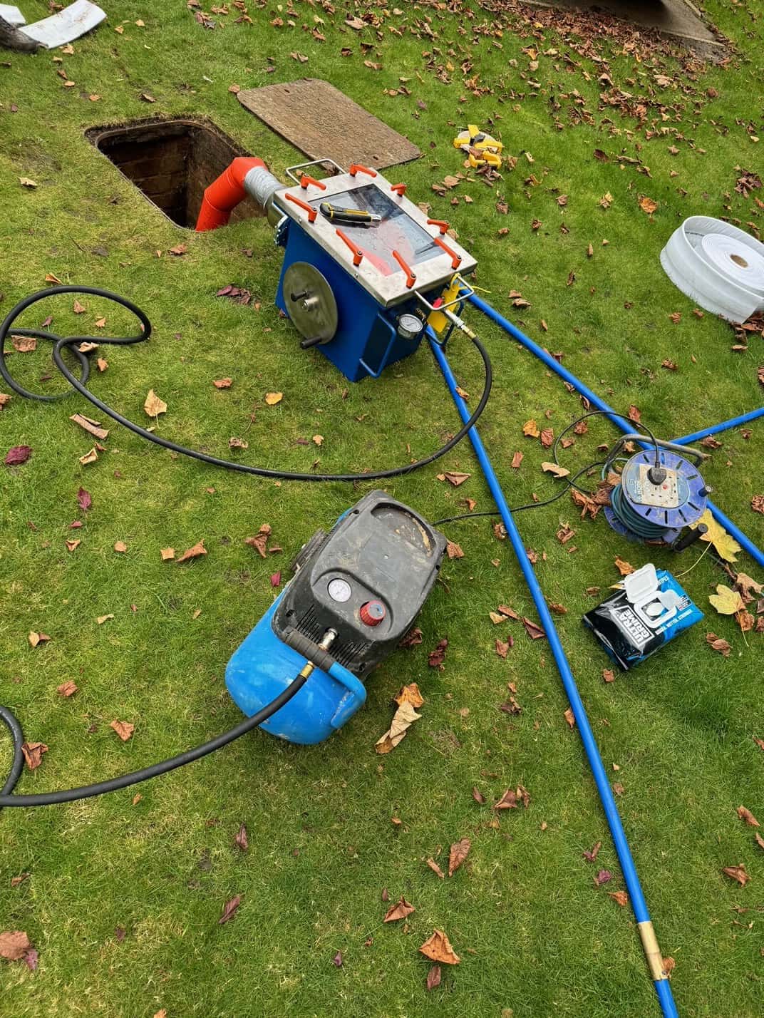 Drain relining process with specialized equipment for pipe restoration.